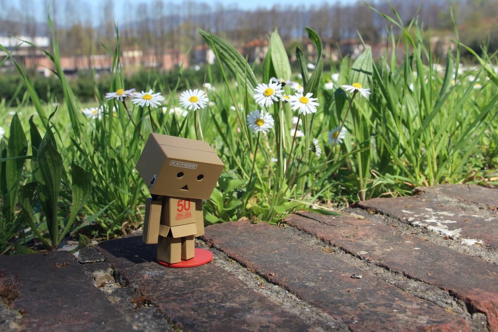 statue of boxes looking sadly at the ground, no creative ideas