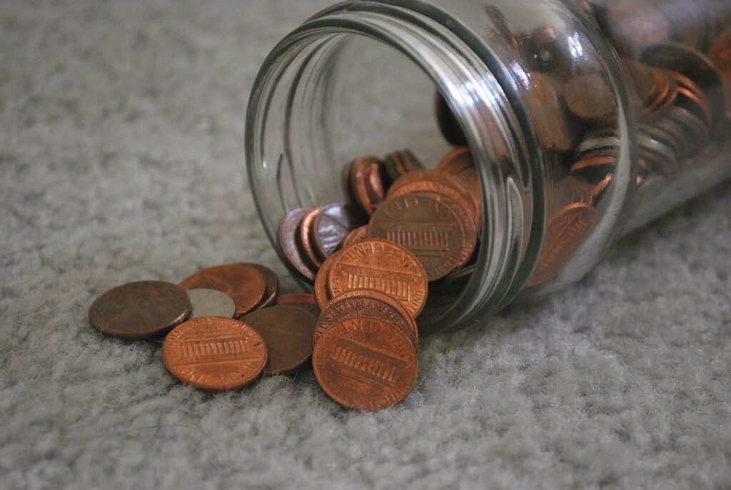 coins spilling out of a jar