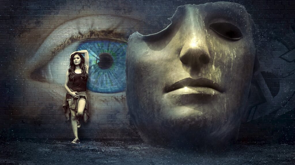 woman standing next to a gigantic mask by a wall; covering or hiding concept